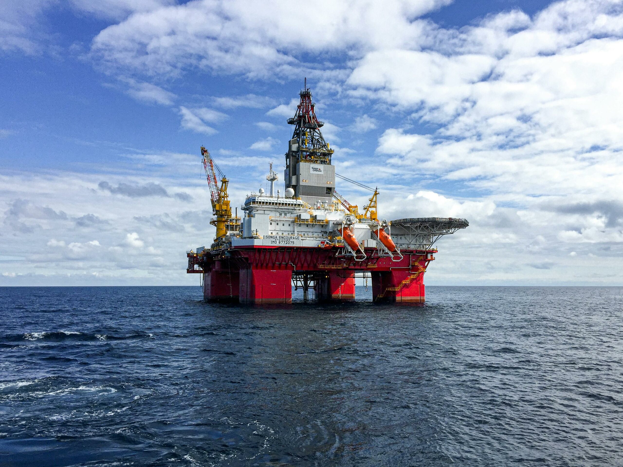 Majestic offshore oil platform under a bright sky in the North Sea, showcasing Norway