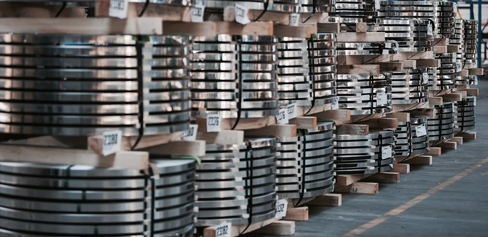 Contact Slit stainless steel strip coils strapped on pallets